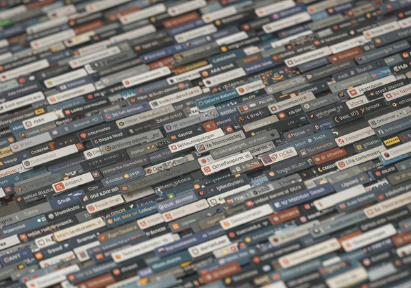 Computer screen with many browser tabs open, slowing system.